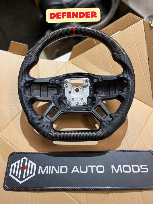 DEFENDER ORIGINAL CARBON FIBER STEERING